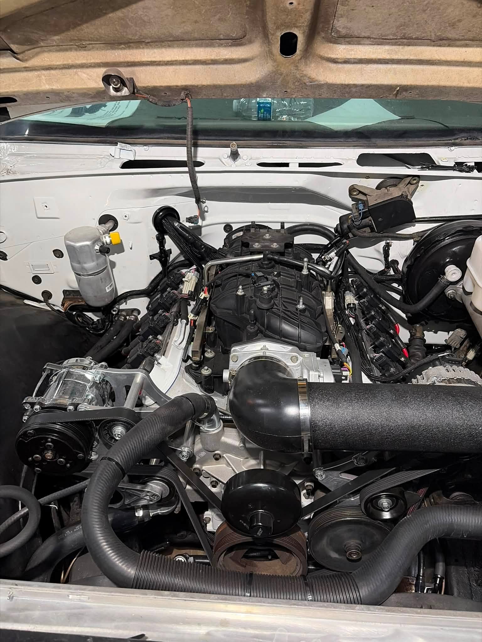 Detailed engine installation photographed at Tacot Garage